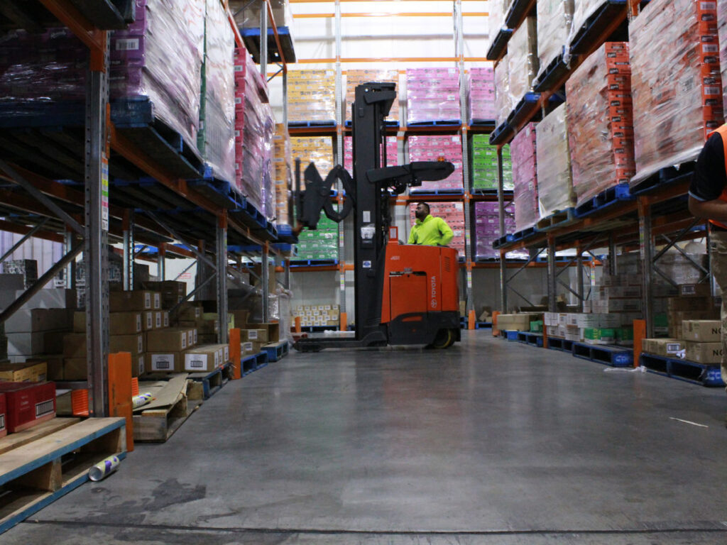 Refrigerated transport truck loading baked goods for cold freight