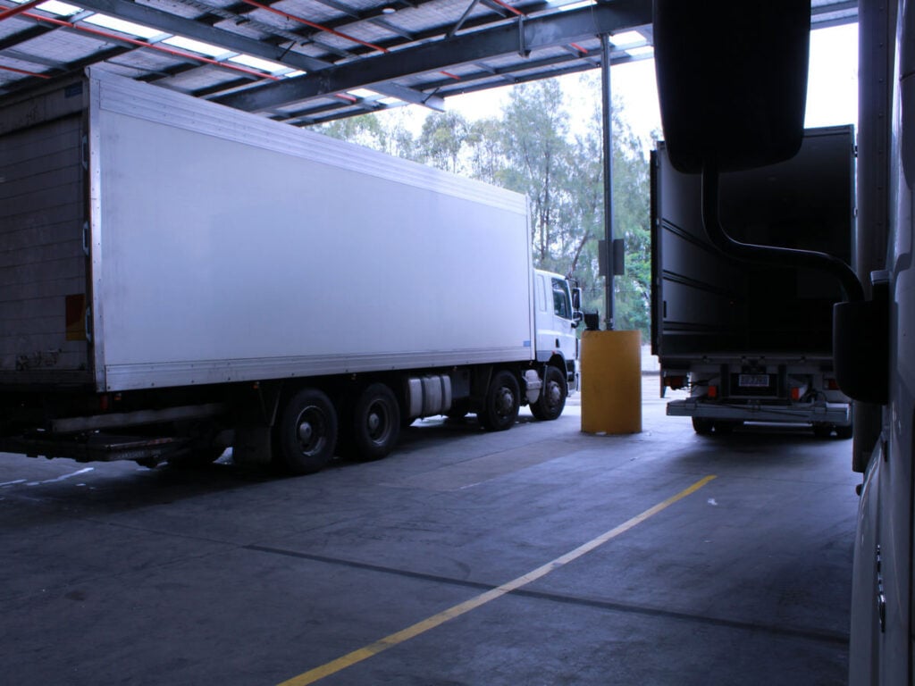 Temperature-controlled meat transport vehicle departing facility