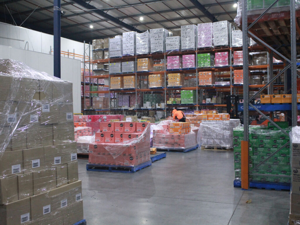 Cold freight pallets of flowers in temperature-controlled facility