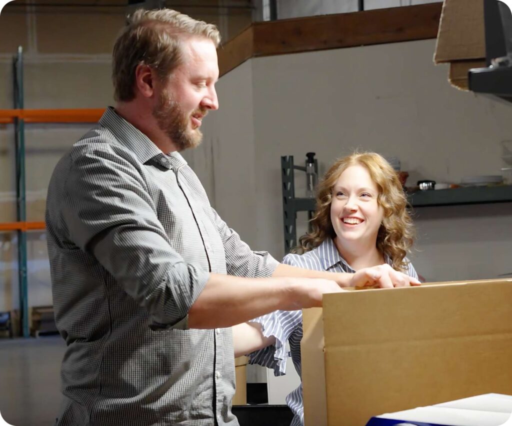 Warehouse staff preparing boxes for shipment